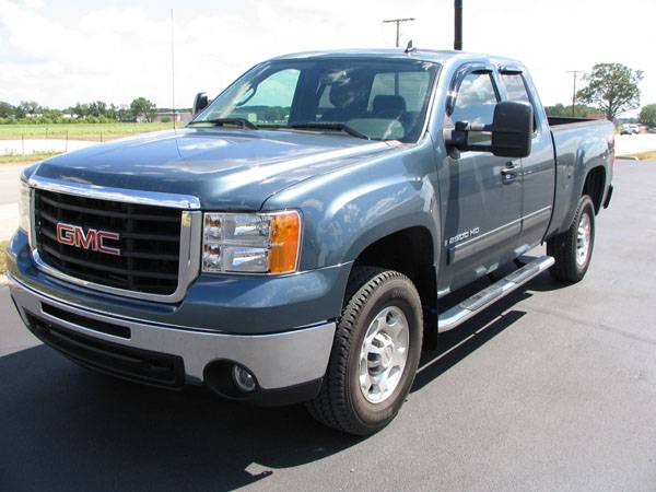 2011 GMC Sierra with Dee Zee 5" Step Bars and Luverne Contoured Mud Flaps