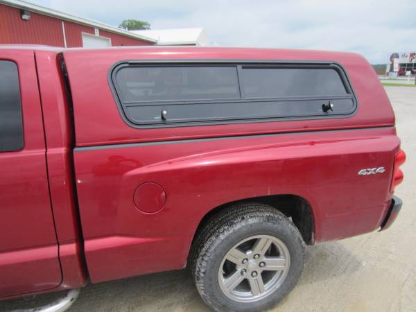 A side view of the sleek Jason Pace Cap with convenient double T-handle sliding side windows!