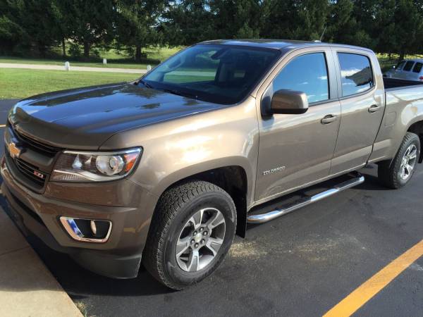 A 2014 Chevy Colorado Crew Cab with Luverne 3" SST Nerf Bars and Weathertech Mud Guards!