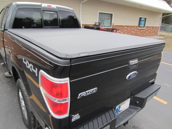 A durable Torza Top Tri-Folding Tonneau an a 2013 Ford F-150 Super Cab