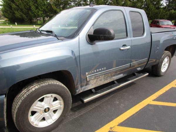 The 2013 Chevy Silverado with TrailFX Running Boards and Putco Chrome Door Handles!