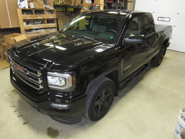 GMC Sierra Elevation with Luverne Black 3" Round Nerf Bars and BAK BakFlip VP Hard Folding Tonneau Cover!