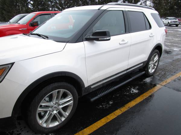 2016 Ford Explorer with black Luverne Omega 2 Running Boards