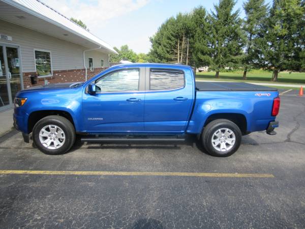 Chevy Colorado With New Runnding Boards, SolidFold Bed Cover, and AVS Winddefelctors.