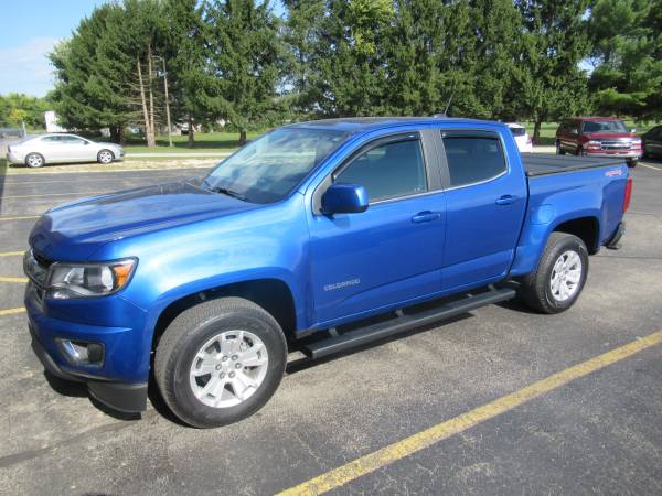 Chevy Colorado With New Runnding Boards, SolidFold Bed Cover, and AVS Winddefelctors.