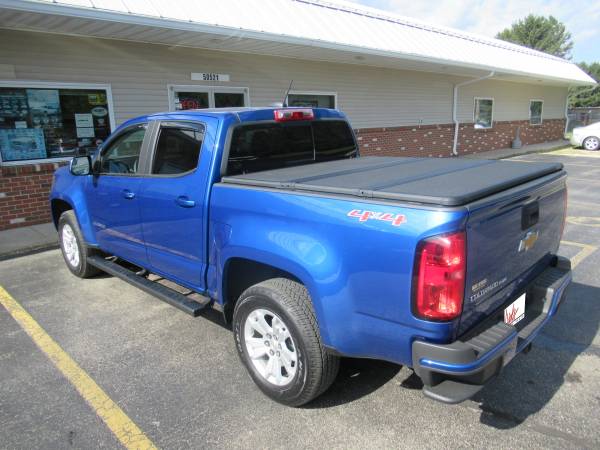 Chevy Colorado With New Runnding Boards, SolidFold Bed Cover, and AVS Winddefelctors.