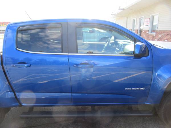 Chevy Colorado With New Runnding Boards, SolidFold Bed Cover, and AVS Winddefelctors.