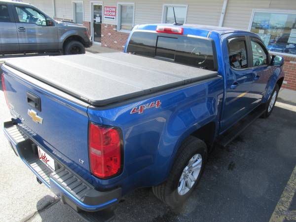 Chevy Colorado With New Runnding Boards, SolidFold Bed Cover, and AVS Winddefelctors.