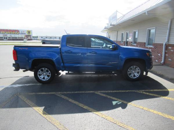 Chevy Colorado With New Runnding Boards, SolidFold Bed Cover, and AVS Winddefelctors.