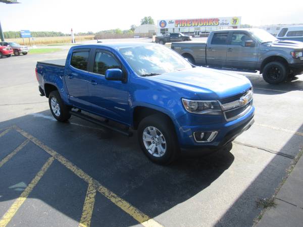 Chevy Colorado With New Runnding Boards, SolidFold Bed Cover, and AVS Winddefelctors.